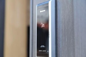 A close-up of a digital display on a door, likely indicating a security or access system. - Kin・ Tengachaya8-14 (Osaka)