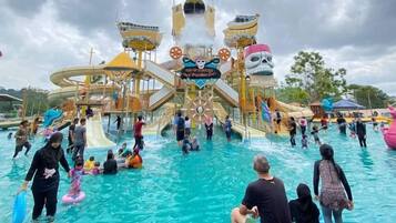 A water park with multiple slides and a central water feature.