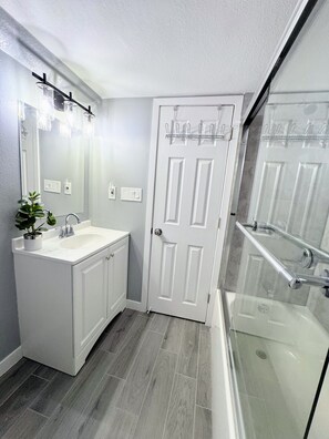 Shower, hair dryer, towels, soap