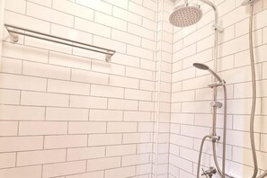 A shower with a handheld showerhead and a wall-mounted rain showerhead. - MEEMAW'S HOUSE (Bangkok)