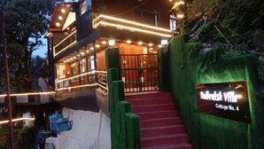 A building with a sign reading 'Patrimonial Villa College No. 4' and a staircase leading to the entrance. - Rudhraksh Villa 4BR- Perfect Vacay Villa (Mussoorie)