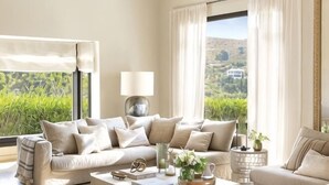 A living room with a sofa set, a coffee table, and a lamp. - All About La Boheme (Benahavis)