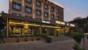 A hotel with a modern facade, a restaurant, and a room service area. - Hotel Saubhagya Ahmedabad (Ahmedabad)