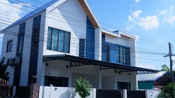 A modern two-story house with a flat roof, large windows, and a covered porch. - TT63/2 cozy private house near the city (Chiang Mai)