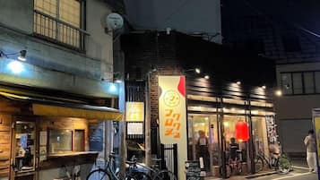 A building with a storefront and bicycles parked outside.
