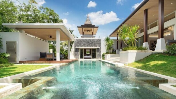 A modern house with a swimming pool, a covered patio, and a pagoda-style structure.