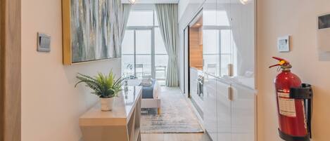 Deluxe Studio, Balcony, City View | Living area | 55-inch Smart TV with digital channels