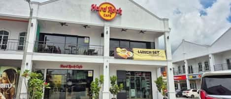 A Hard Rock Cafe with a prominent sign, a second-story balcony, and a 'Lunch Set' banner.