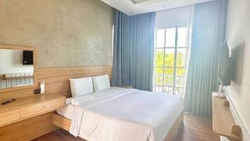 Desk, blackout drapes, iron/ironing board, rollaway beds