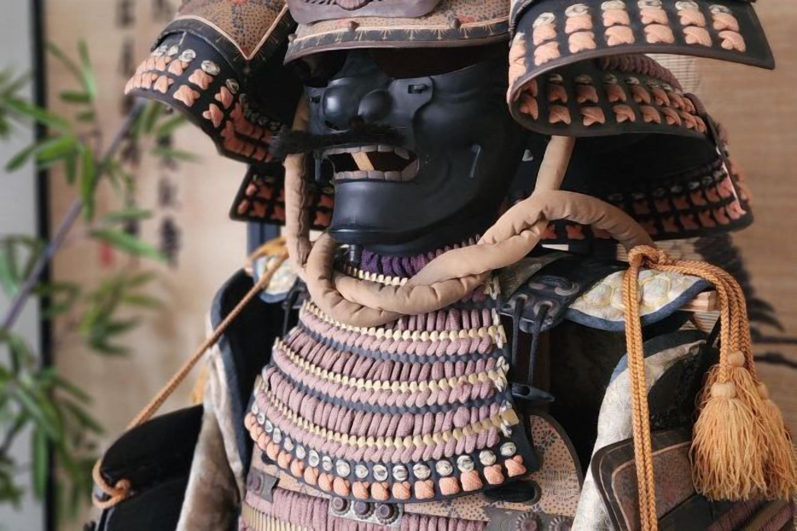 A samurai armor with a helmet, shoulder guards, and a chest plate.