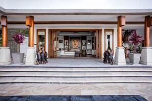 A hotel entrance with a covered porch, steps leading to the entrance, and potted plants. - Villa ZeniMo, Surin Beach, pool, 9 BR 18 guests (Phuket)