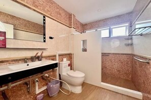 A bathroom with a shower, toilet, and sink. - Chasing Light Villa (Pattaya)