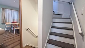 A staircase with wooden steps and white handrails, leading to an upper floor. - Tabitime Teradacho - 5 min to JR station~grand new house~max 8ppl (Osaka)