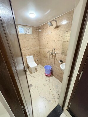 Deluxe Double Room, City View | Bathroom | Shower, slippers, towels, soap - The Kashi Elegance Varanasi (Varanasi)