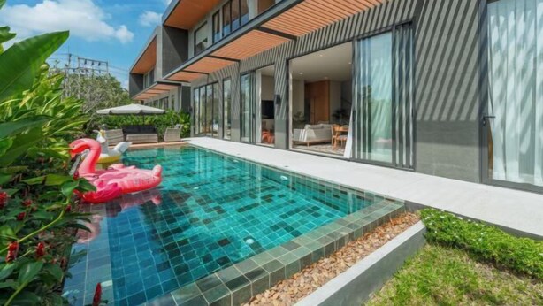 A modern house with a swimming pool, large windows, and a well-maintained garden. - Long One A5 (Phuket)