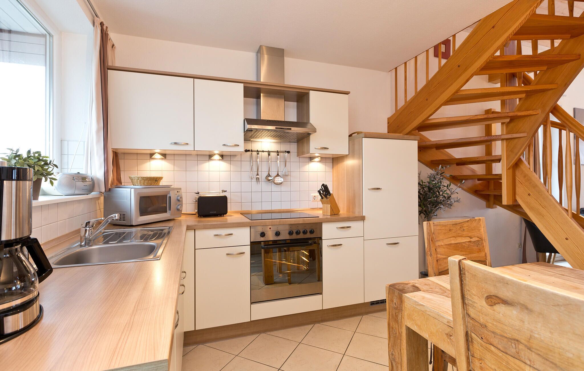 Fridge, stovetop, dishwasher, coffee/tea maker