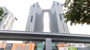 A multi-story building with a prominent central structure.