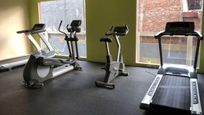 A gym with treadmills, ellipticals, and a stationary bike. - Taman Sari Sudirman Studio Deluxe B / Near MRT / Central Jakarta (South Jakarta)