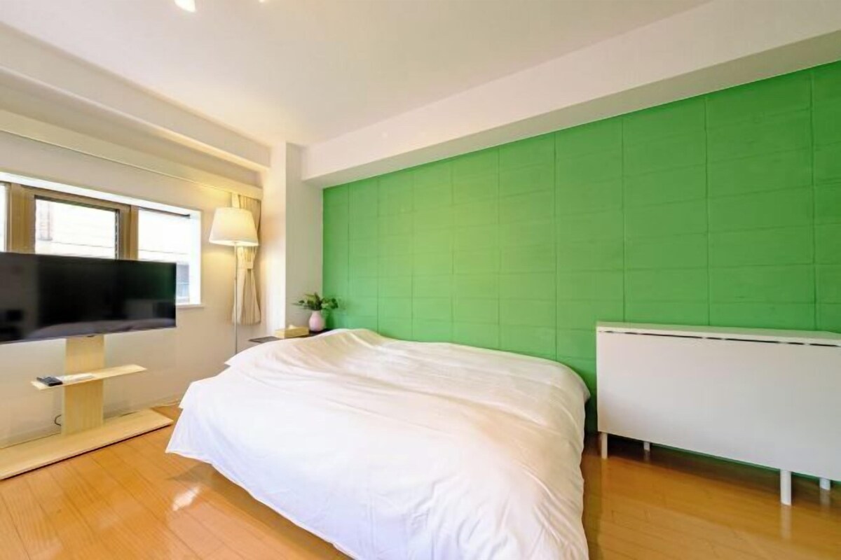 Desk, iron/ironing board, bed sheets