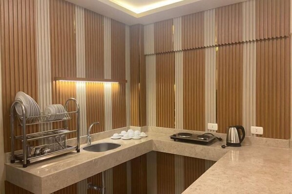 A modern bathroom with a vanity, sink, and towel rack. - Regina Beach Resort El Sokhna (Ataqah)