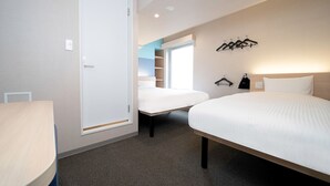 A hotel room with a bed, a bedside table, a wardrobe, and a coat rack. - Hop Inn Tokyo Ueno (Tokyo)