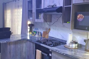 Private kitchen - Modern and Cozy Apartments (Lusaka)
