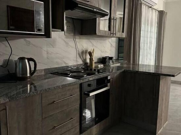 Private kitchen - Modern and Cozy Apartments (Lusaka)