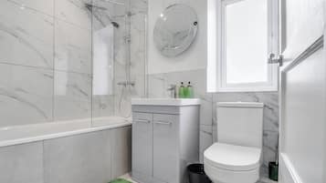 Combined shower/bathtub, deep-soaking bathtub, hair dryer, towels
