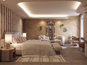 Ein modernes Schlafzimmer mit einem großen Bett, Nachttischen, einer Sitzecke und dekorativen Wandbildern.