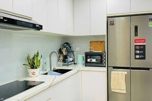 Private kitchen - Suzon Resort Residence at Lumiere Boulevard, Vinhomes Grand Park (Ho Chi Minh City)