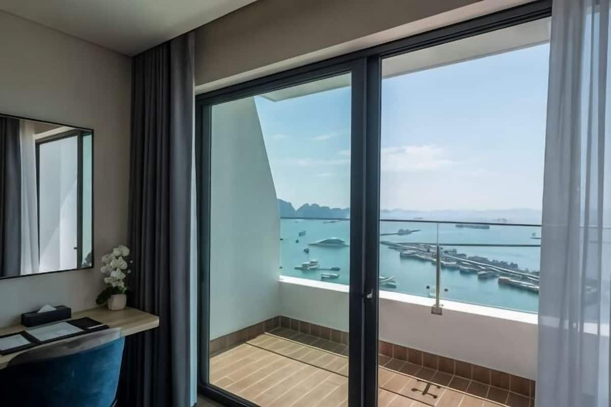 A balcony with a view of a marina and boats.