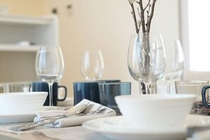A dining table set with white plates, silverware, and clear glassware. - 2 stops 5 minutes to Ikebukuro, 7 stops to Shinjuku 15 minutes, new 1LDK (Tokyo)