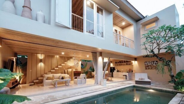A modern two-story house with a pool, outdoor seating, and a staircase leading to the upper floor. - Sapta Villa Ubud (Bali)