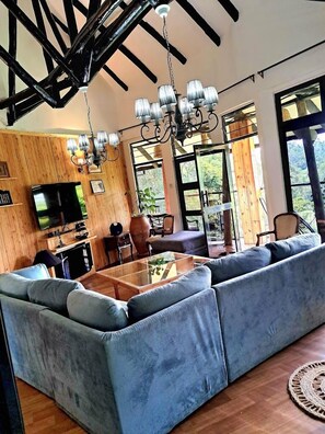 Family Cottage, Balcony, Garden View | Living area | 32-inch Smart TV with digital channels