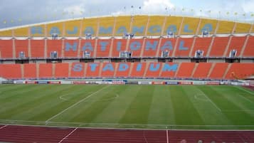 A stadium with 'NATIONAL STADIUM' written on the stands.