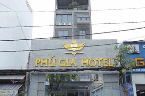 A hotel sign with a logo and the name 'PHÚ GIÁ HOTEL'. - Phu Gia Hotel 228 Le Van Luong (Ho Chi Minh City)