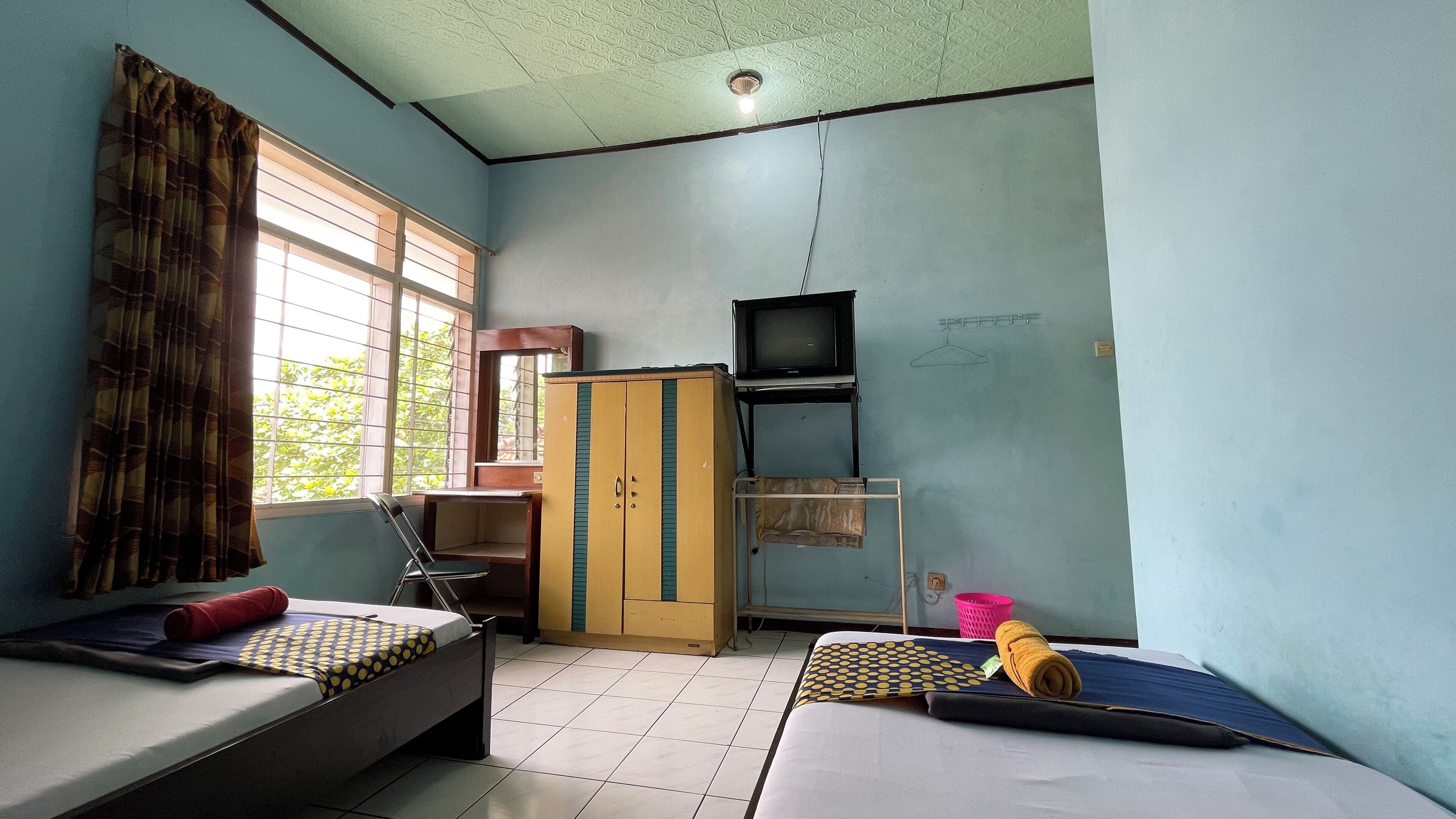 デラックス ルーム | 遮光カーテン、防音設備、WiFi (無料)、ベッドシーツ