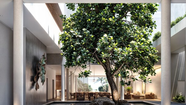 Ein moderner Innenhof mit einem zentralen Baum, einer Sitzgelegenheit und einem Wasserspiel.