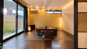 A modern interior with a dining area, sliding doors, and a view of the outdoors. - KandoStay Asakusa East Terrace (Tokyo)