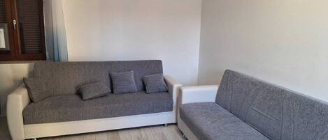 Deluxe Apartment, Balcony | Living area