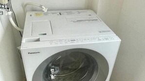 A white Panasonic washing machine in a corner of a room. - YMK Oshiage 7B (Tokyo)