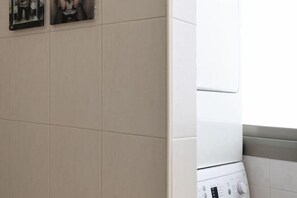 Laundry room - Cozy 3BR Apt w Big Windows 5 Min Walk From Beach (Tel Aviv)