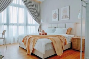 A modern bedroom with a large bed, a chair, and a window with curtains. - Delight Homestay Paradigm Residence (Tebrau)