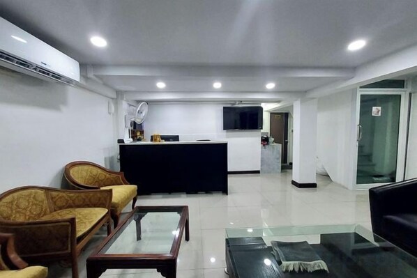 A modern living room with a sofa set, a coffee table, and a TV. - Rustic Comfort Zone (Pattaya)