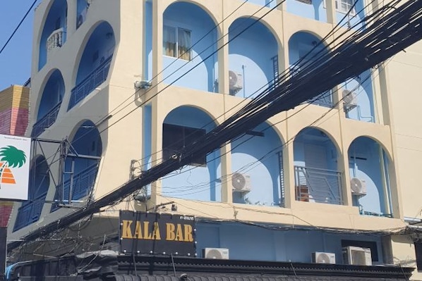 A multi-story building with a sign for 'KALA BAR' on the ground floor. - Rustic Comfort Zone (Pattaya)