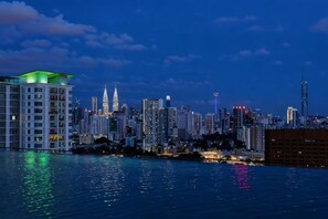 A city skyline with high-rise buildings, a prominent tower, and a waterfront. - THE PANO BY FEEL HOME (Kuala Lumpur)
