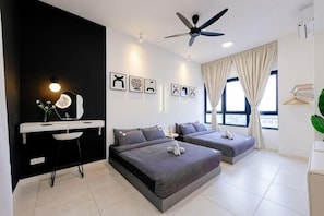 A modern bedroom with a desk, two beds, a ceiling fan, and large windows. - THE PANO BY FEEL HOME (Kuala Lumpur)
