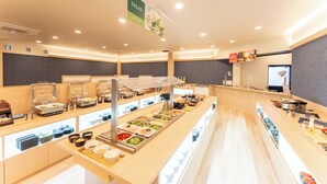 A buffet area with various food stations and a sign indicating a salad section. - MAX CUBE Inami Seafront (Inami)
