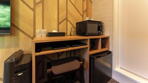 A compact kitchenette with a microwave, a small refrigerator, a coffee maker, and a trash bin. - MAX CUBE Inami Seafront (Inami)