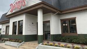 A building with a sign reading 'Denny's' and a large entrance with steps leading up to it. - Ikebukuro No`3 (Tokyo)